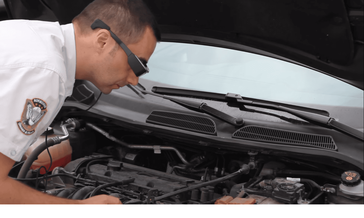 Man using Epson Moverio Smartglass to diagnose car engine